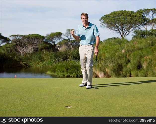 Ecstatic man playing golf