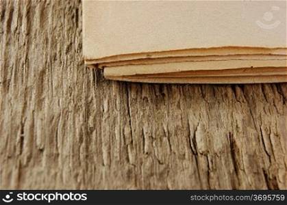edge of the old newspaper on a wooden background