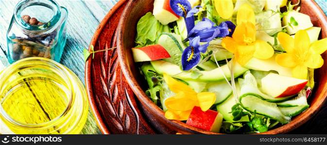 Edible flowers salad. Vegetarian salad leaves with herbs and flowers.Healthy food