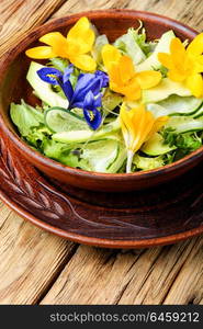 Edible flowers salad. Vegetarian salad leaves with herbs and flowers.Healthy food