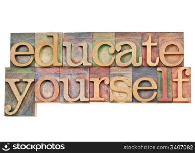 educate yourself - personal development concept - isolated text in vintage wood letterpress printing blocks stained by color inks