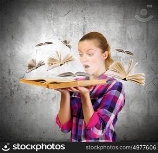 Education advantage. Young pretty woman in casual holding opened book