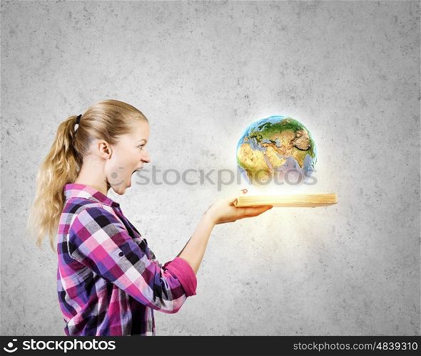 Education advantage. Young woman in casual hiding face behind reading. Elements of this image are furnished by NASA