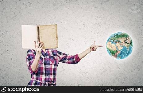 Education advantage. Young woman in casual hiding face behind reading. Elements of this image are furnished by NASA