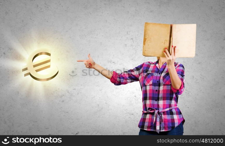 Education advantage. Young woman reading book and pointing at euro sign