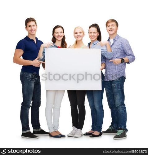 education, advertisement, sale and people concept - group of smiling students pointing at blank white board