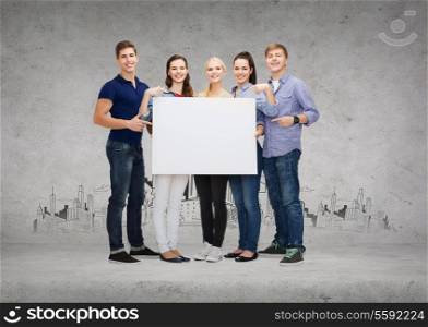 education, advertisement, sale and people concept - group of smiling students pointing at blank white board