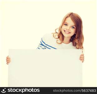 education and blank board concept - smiling little girl with blank white board