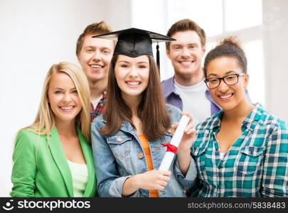 education and competition concept - girl in graduation cap with certificate and students