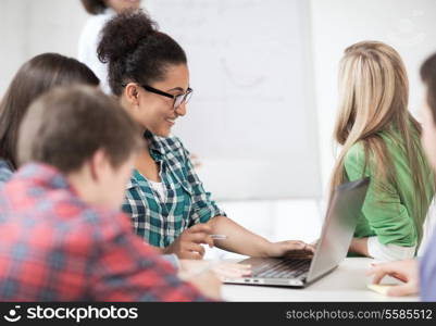 education and internet - african student girl with laptop at school