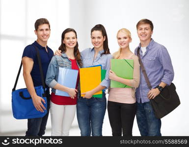 education and people concept - group of smiling students standing