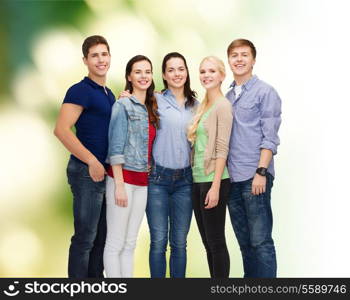 education and people concept - group of smiling students standing