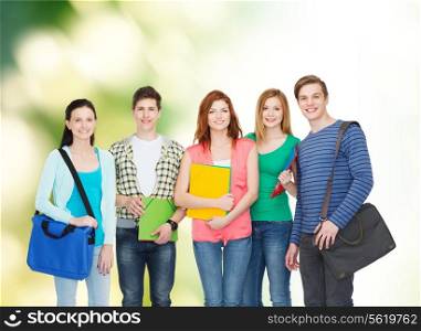 education and people concept - group of smiling students standing