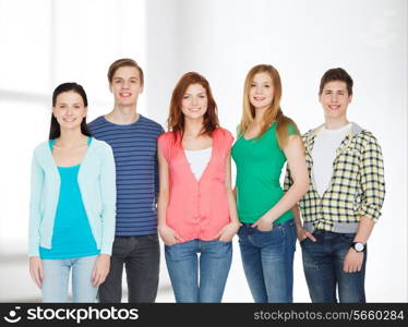 education and people concept - group of smiling students standing