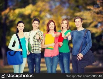 education and people concept - group of smiling students standing