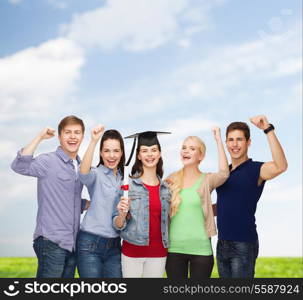 education and people concept - group of standing smiling students with diploma and corner-cap