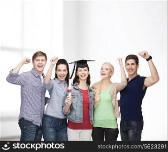 education and people concept - group of standing smiling students with diploma and corner-cap