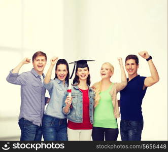 education and people concept - group of standing smiling students with diploma and corner-cap