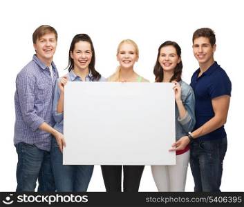 education and people concept - group of standing smiling students with white blank board