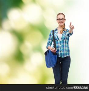 education and people concept - smiling female student in eyeglasses with laptop bag showing thumbs up over green background