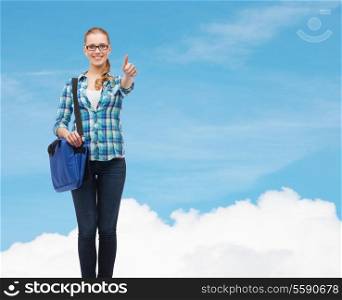 education and people concept - smiling female student in eyeglasses with laptop bag showing thumbs up over blue sky background