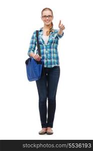 education and people concept - smiling female student in eyeglasses with laptop bag showing thumbs up