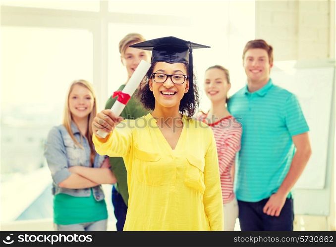 education and people concept - smiling female student with diploma and corner-cap and friends on the back