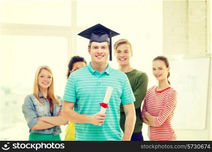 education and people concept - smiling male student with diploma and corner-cap and friends on the back