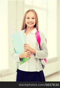 education and school concept - happy and smiling teenage girl