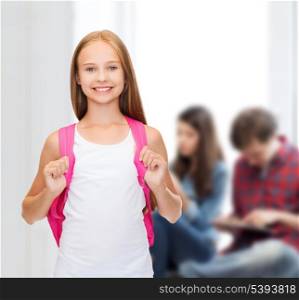 education and school concept - happy and smiling teenage girl in blank white tank top