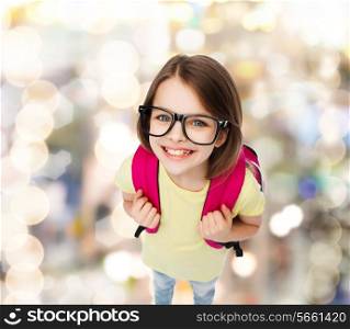education and school concept - happy and smiling teenage girl in eyeglasses with bag