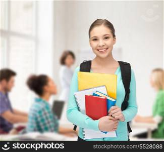 education and school concept - happy and smiling teenage girl with backpack and books