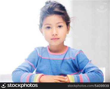 education and school concept - little student girl at school