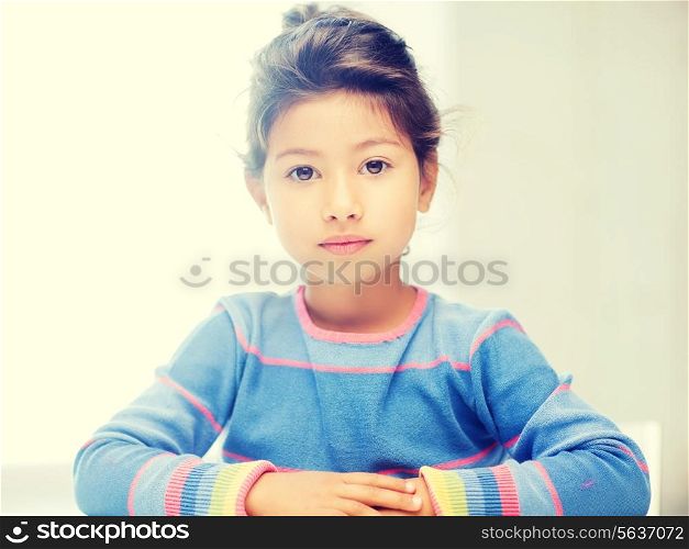 education and school concept - little student girl at school