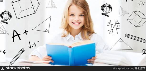 education and school concept - little student girl studying and reading books at school. student girl studying at school