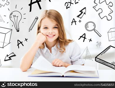 education and school concept - little student girl studying at school