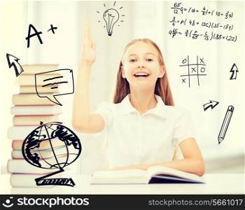 education and school concept - little student girl with books raising hand up at school