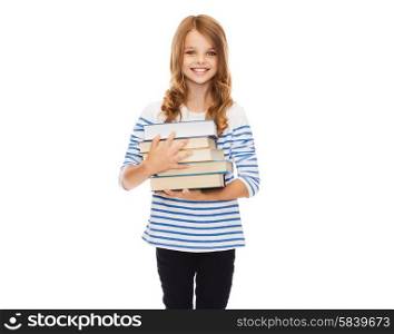 education and school concept - little student girl with many books. little student girl with many books