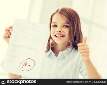 education and school concept - little student girl with test and A grade at school showing thumbs up