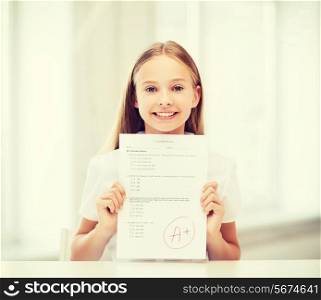 education and school concept - little student girl with test and grade at school