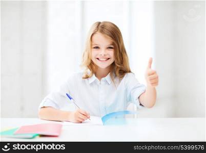 education and school concept - smiling student girl studying at school