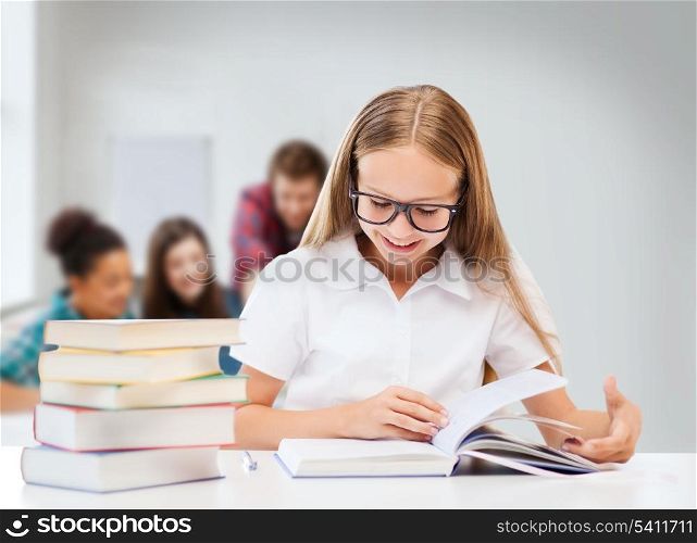 education and school concept - student girl studying and reading books at school