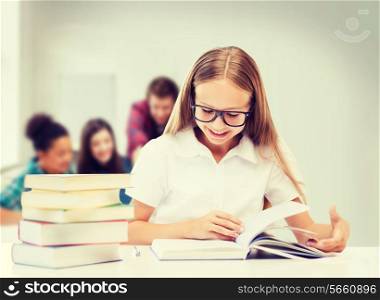 education and school concept - student girl studying and reading books at school