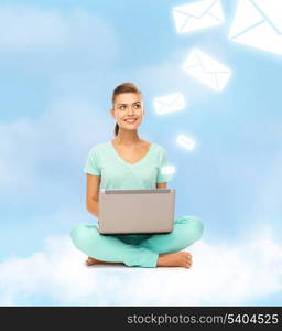 education and technology concept - young woman sitting on the cloud with laptop