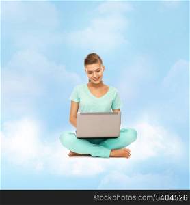 education and technology concept - young woman sitting on the cloud with laptop