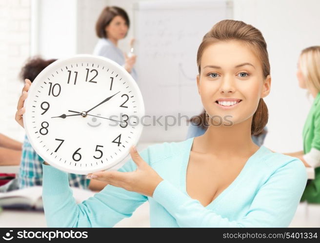 education and time management - attractive student pointing at clock