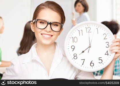 education and time management concept - attractive student showing clock