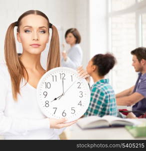 education and time management concept - attractive student showing clock