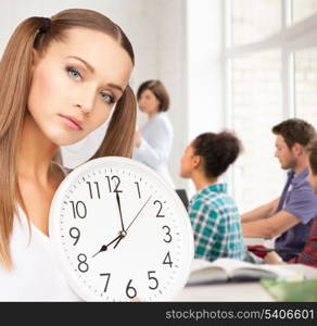 education and time management concept - attractive student showing clock