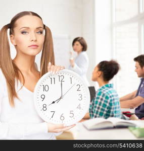 education and time management concept - attractive student showing clock